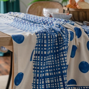 Blue geometric print cotton linen tablecloth in a cozy dining room home setting