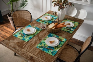 Set of four rectangular tie-dye placemats with abstract green and blue watercolor pattern