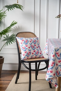 Detailed close-up of pastoral cotton linen tablecloth with pink tulip floral patterns