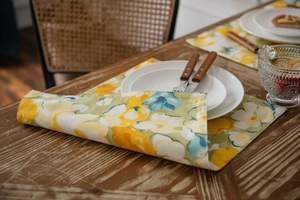 Close-up of yellow floral cotton linen table runner with rustic pattern detail