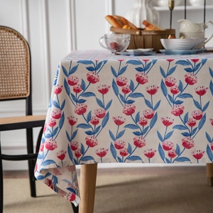 Floral cotton linen tablecloth with pink tulips and blue leaves on off-white fabric