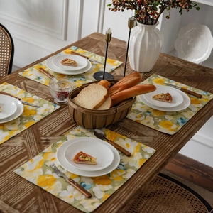 Floral print rectangular table runner set with yellow flower pattern on dark wood table
