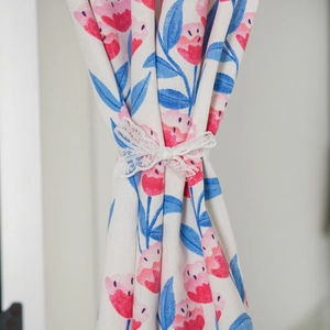 Pink tulip floral curtain fabric with white lace bow tie and natural linen texture