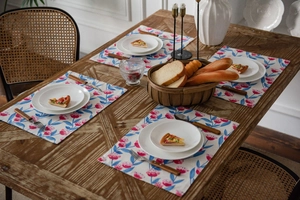 Close-up of pink floral pattern table runner and placemats set for dining table decor