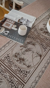 Detail of Chinese style table runner featuring mountain jacquard and textured fabric