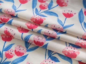 Close-up of pink tulip print on durable linen-cotton fabric with fine weave detail