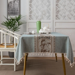 Elegant Chinese style table runner in pale green fabric with brown floral pattern and tassels
