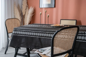 Detailed view of bohemian linen tablecloth with black and white geometric ethnic patterns