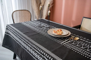 Detail of bohemian black cotton linen tablecloth with white tribal geometric patterns