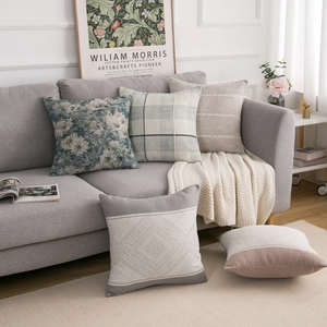Detailed view of modern geometric cushion covers with textured cotton linen fabric mix