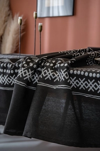Detail of bohemian black and white geometric print on thick linen fabric for home decor