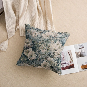 Close-up of jacquard woven vintage floral throw pillow cover on a cozy rug