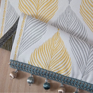 Jacquard table runner featuring yellow leaves pattern with elegant beaded tassel fringes