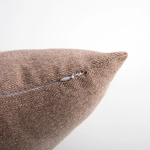 Close-up of the high-quality invisible zipper and textured fabric on coffee cushion cover