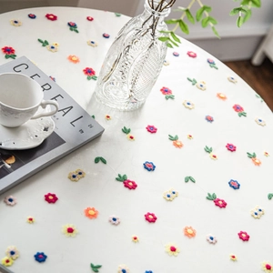 White lace tablecloth with colorful floral embroidery for elegant home table decoration