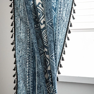 Bohemian blue geometric print curtains with elegant black tassel trim for windows
