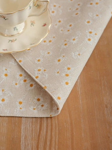 Detailed macro view of small daisy print on high-quality linen cotton placemat fabric