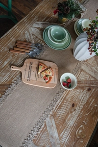 Macro shot of rustic natural jute table runner with delicate crochet lace edge detail