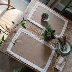 Natural jute table placemats with white fringe tassels for rustic dining table decor