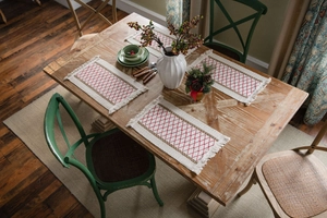Detail of red geometric diamond pattern weave and fringe on cotton linen table runner