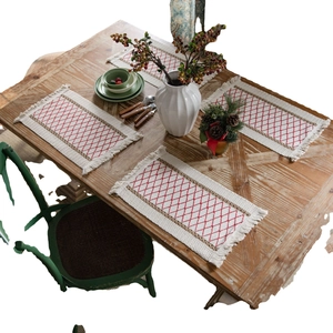 Set of 4 woven rectangle placemats with red diamond embroidery and elegant side tassels