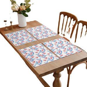 Set of 4 rectangle floral cotton linen placemats with pink flower prints on a wooden table