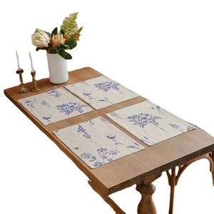 Set of four cotton linen placemats with blue floral sketch prints for dining tables