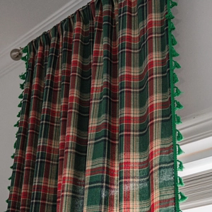 Green and red plaid curtain with fringed tassels in retro American cottage style