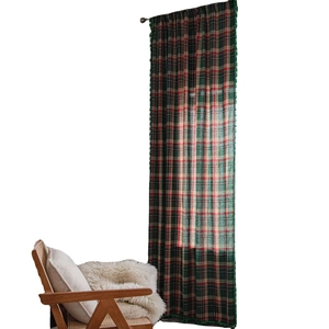 Green plaid semi-blackout curtains with fringe trim for home decor on white background