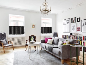 Detail of black bohemian short curtain with white geometric patterns and tassel trim edges