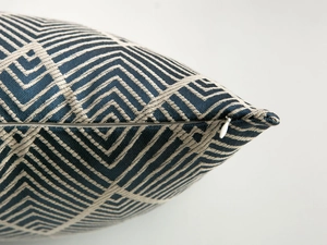 Detail of woven geometric diamond pattern cushion cover with high-quality hidden zipper