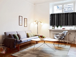 Detail of bohemian geometric black half curtain with elegant fringe tassels for kitchen