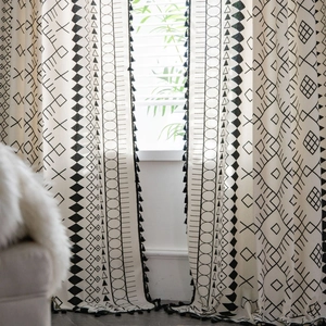 Bohemian black and white geometric print curtains with elegant black tassel edges