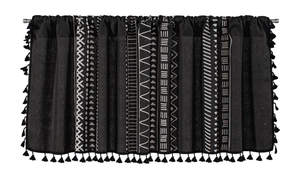 Detail of black cotton linen cafe curtain with white geometric prints and tassel fringe