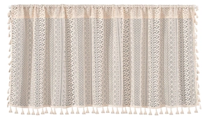 Detail of bohemian hollow lace curtain with geometric patterns and fringe trim