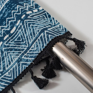 Blue and white geometric pattern kitchen curtain with decorative black fringe tassels