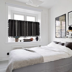Black geometric print cafe curtain with white tribal patterns and decorative tassels