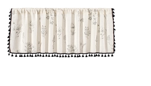 Detail of floral printed cotton linen cafe curtain with small black tassel fringe trim