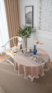 Detail of round linen-blend tablecloth with tassel edge and Chinese pine mountain prints