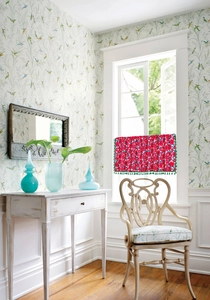 Floral red cafe curtain with green tassels in a vintage interior setting