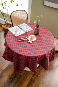 Macro detail of red and blue tartan plaid round tablecloth with premium fabric texture