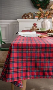 Close-up of red tartan tablecloth with thick texture for Christmas holiday table decor