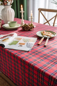 Detailed texture of red plaid tablecloth with classic tartan pattern for festive dining decor