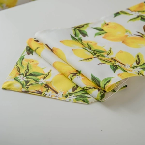 Table runner with fresh yellow lemon print and high-density textile texture detail