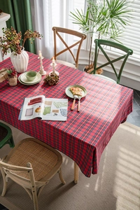 Classic red checkered tablecloth on wooden table with elegant floral decoration