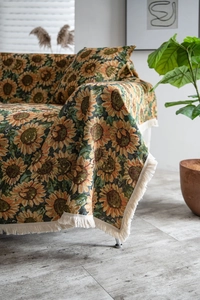 Macro detail of high-density jacquard weaving and white fringe on sunflower sofa cover