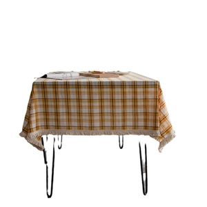 Classic yellow and white plaid tablecloth with handmade fringe edges in rustic cotton linen