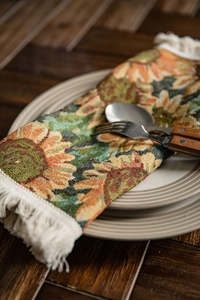 Close-up of jacquard sunflower table runner with thick texture and fringe edge