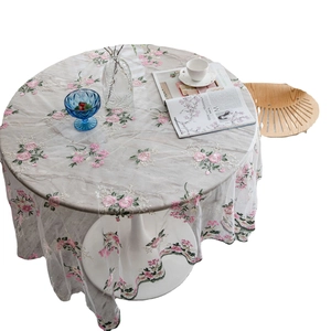 Elegant white lace tablecloth with pink floral embroidery and scalloped edges for home decor