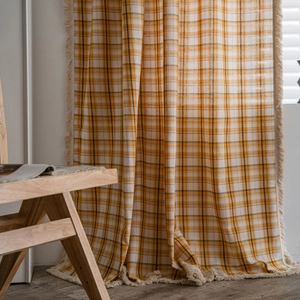 Rustic yellow and beige plaid curtains with elegant cream tassels for cozy window decor